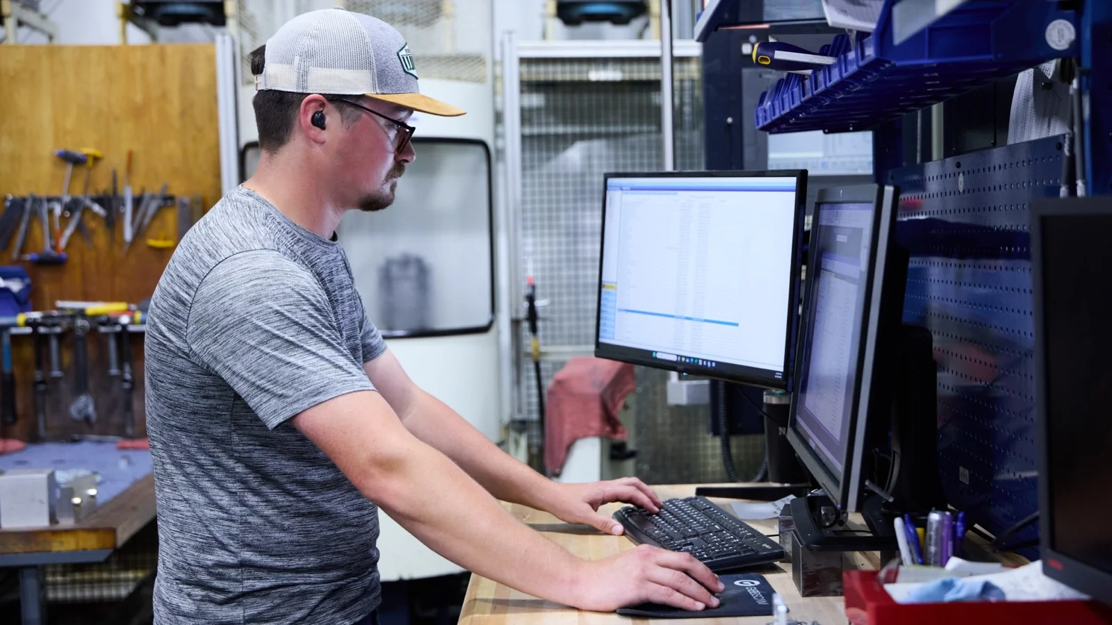 Taylor Machine engineer working at a computer workstation